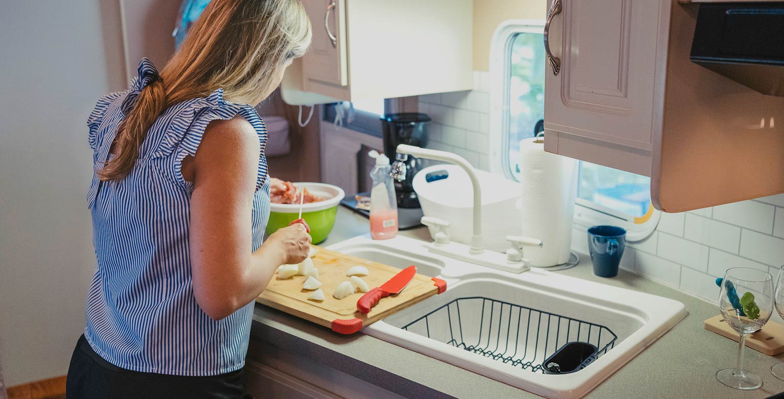 Lady in a kitchen of a manufactured home